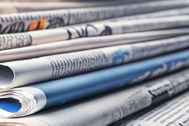 A stack of newspapers.