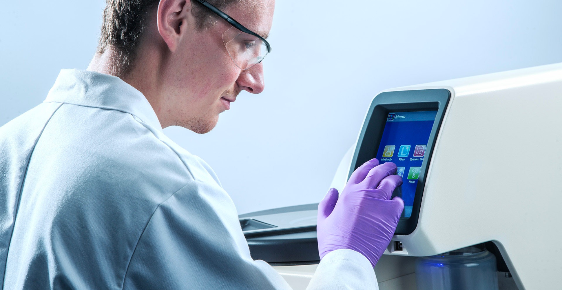 Scientist in a white coat using an SP product.